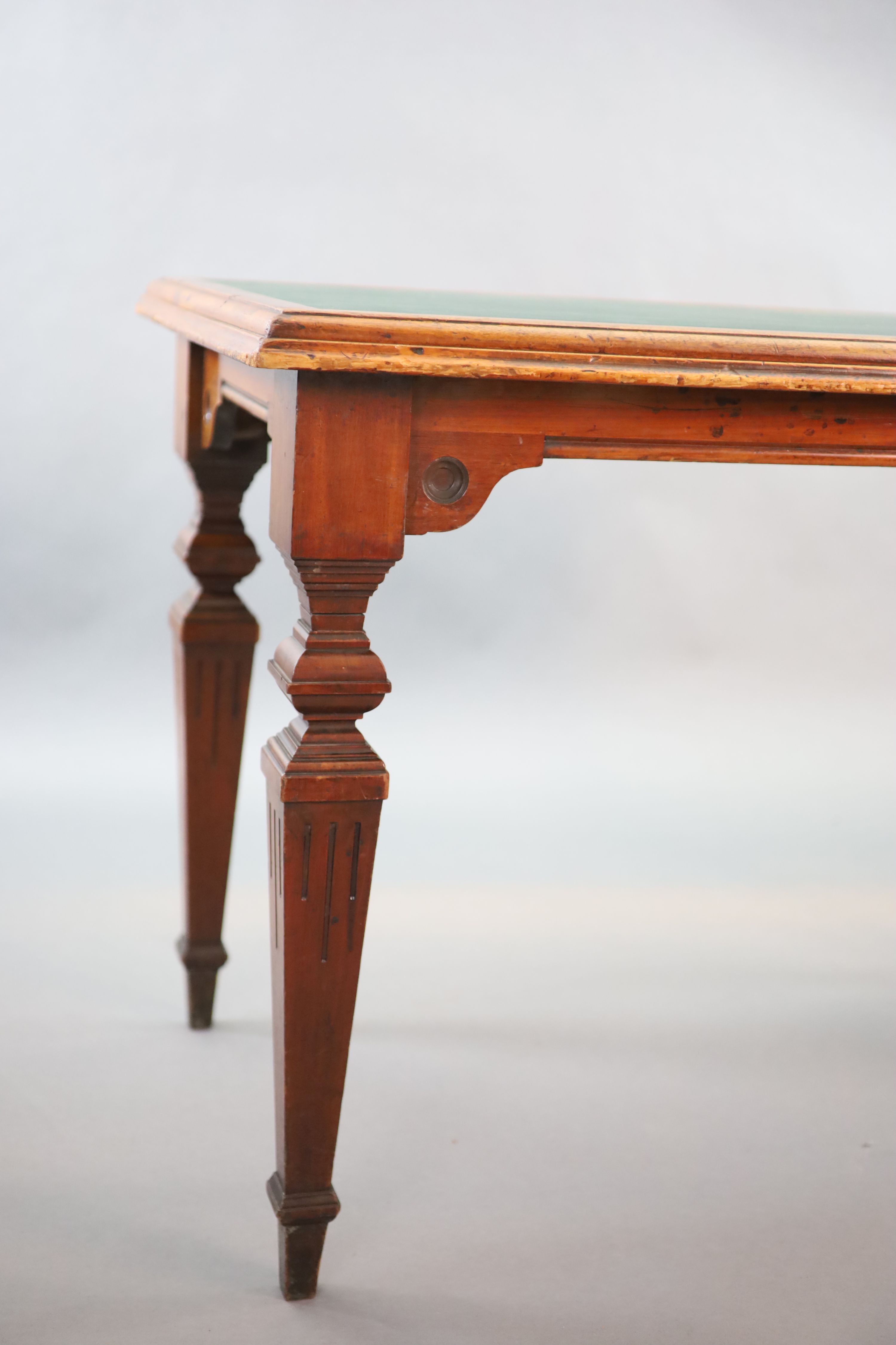 A late Victorian mahogany writing table, supplied by Sage & Co. Shopfitters of London, W.112cm D.68cm H.79cm